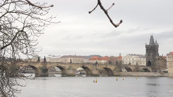 Czechia capital  Vltava river and famous Charles bridge slow tilt 4K 2160p 30fps UltraHD footage - C