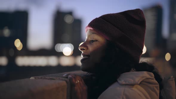 Closeup of an Attractive Woman Looking at City Views at Night