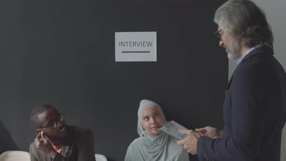 HR Manager Greeting Black Male Candidate with Handshake before Interview