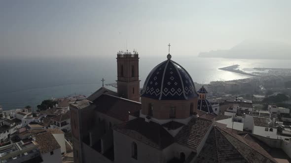 Drone flight over dome of Catholic Church of The Virgin of Consol in Altea, Spain. Aerial.