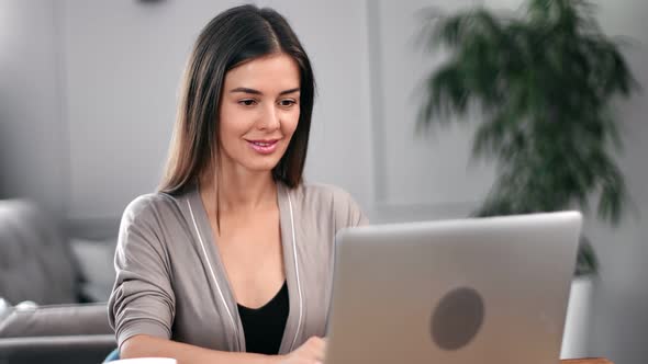 Happy Freelancer Female Working Remotely Use Laptop at Apartment