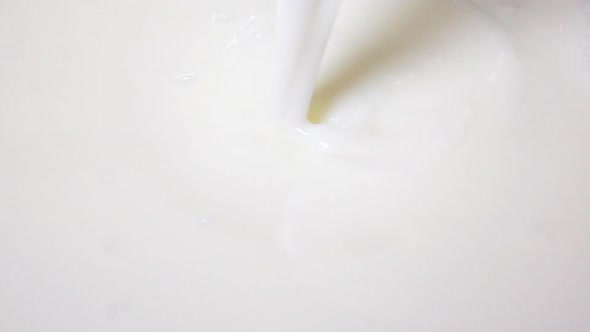 Pouring Milk Into Milk