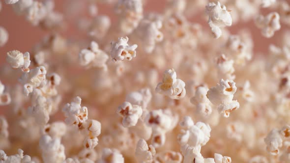 Popcorn tossed up and falling down. Slow Motion.