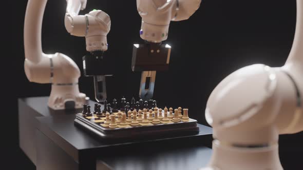 Two robot hands are playing chess.