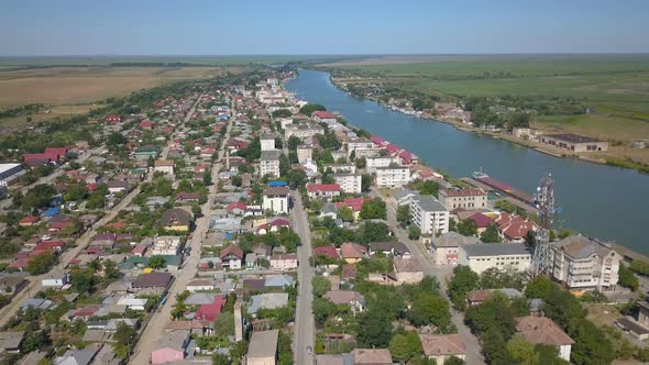 Aerial View Of Sulina City Harbor And The Danube Flowing Into The Black Sea