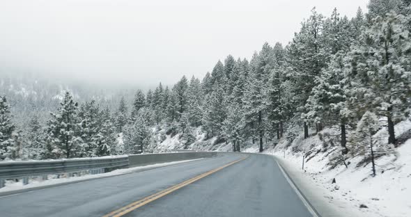 Driving on mountain road in winter