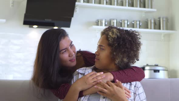 Girlfriend Asian Hugs Her AfricanAmerican Girlfriend From Behind