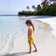 Little girl playing on the ocean beach - VideoHive Item for Sale