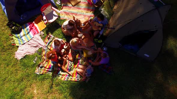 Friends having picnic in park