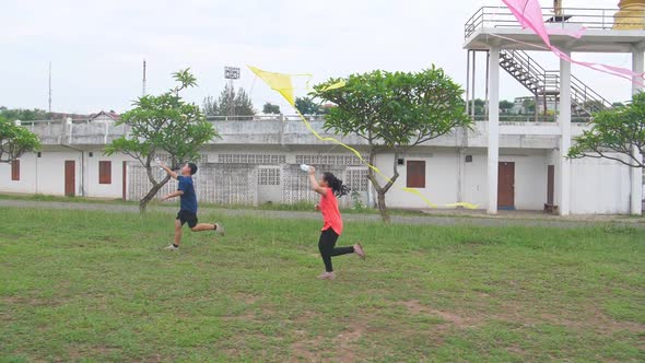 Asian Children Running Kite