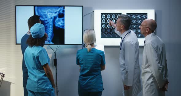 Doctors Discussing MRI Scan Results