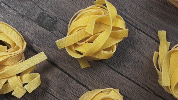 Spaghetti Rolls on a Wooden Table Wiring Slider.