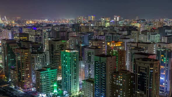 Aerial Skyline of Abu Dhabi City Centre From Above Night Timelapse