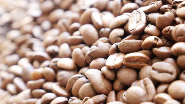 Shallow DOF coffee beans  background  arabica type slow panning 4K 3840X2160 UHD video - Fresh roast