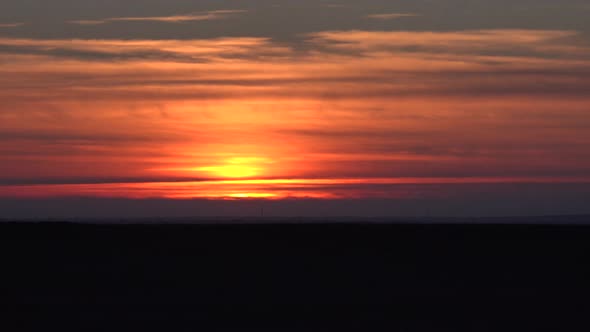 Sunset Over Horizontal Thin Cloud Layers