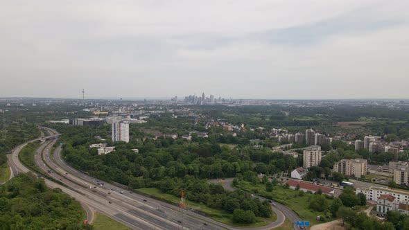 Southbound aerial approach towards the cityscape of Frankfurt, Germany. Wide angle view with busy hi