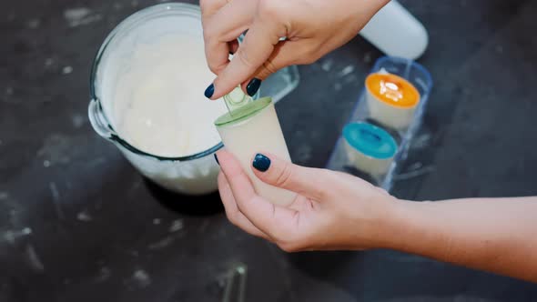 The process of making homemade  ice cream with a blender and molds