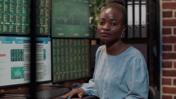 Portrait of Female Broker Using Trade Market Statistics