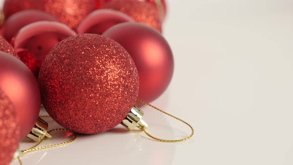 Shallow DOF  red Christmas bauble with sequins slow tilt 4K footage