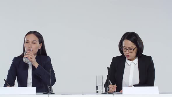 Two Female Politicians Answering Journalists Questions