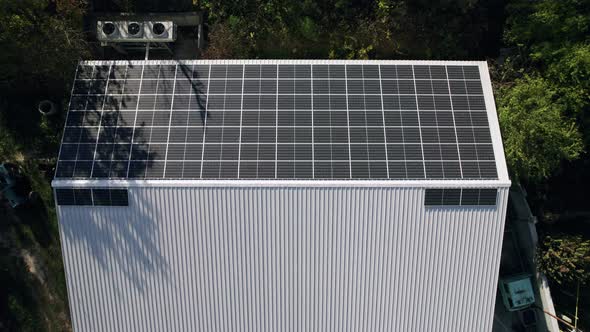 Aerial View of Solar Panels Installed on the Roof of Industrial Building