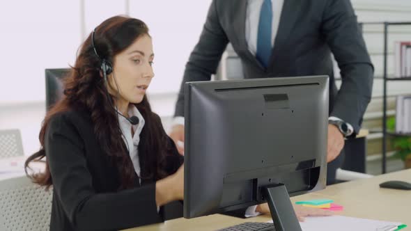 Business People Wearing Headset Working in Office