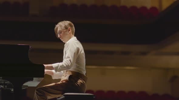 Piano Player Giving Performance on Stage