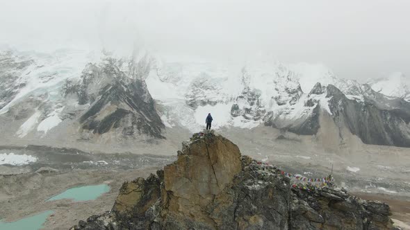 Man on Top of Kalapatthar Mountain. Everest and Nuptse. Nepal. Aerial View