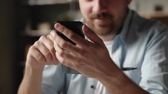 Close Up Focus on Modern Tech Smartphone Gadget in Male Hands