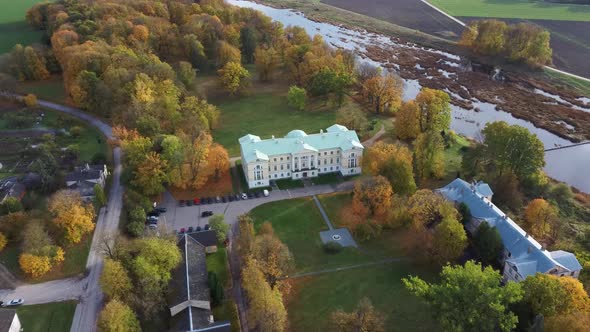 Autumn Aerial Landscape of the City Mezotne and Palace With Park Near Lielupe River, Latvia 4K Video