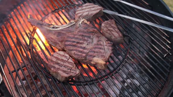 T-bone steak on barbecue grill,