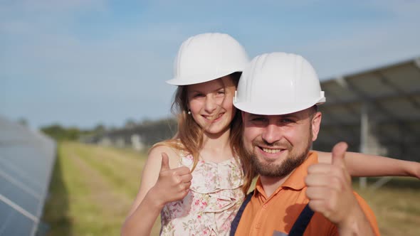 Portrait of the Father of a Solar Power Engineer with His Little Daughter in a