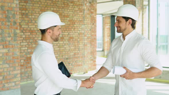 Close Up of Handshake in Construction Site