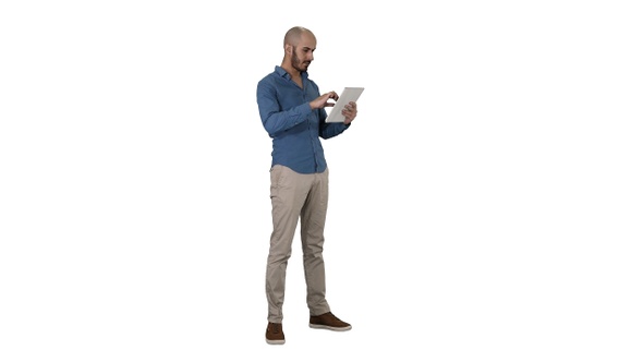 Handsome arabic business man using tablet on white background.