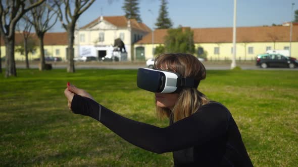 Girl Using Virtual Reality Headset in Park