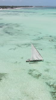 Boat Boats in the Ocean Near the Coast of Zanzibar Tanzania Slow Motion Vertical Video