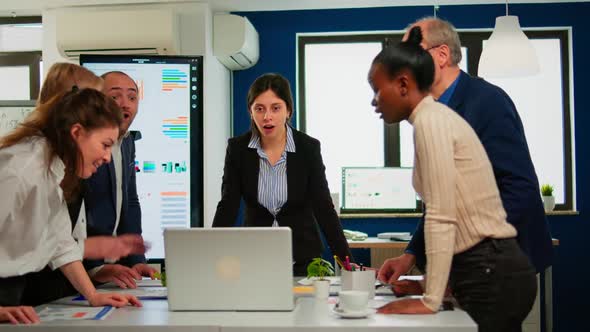 Happy Diverse Businesspeople Giving High Five During Team Corporate Brainstorm