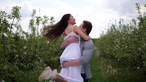 Romantic Young Couple Spending Leisure in Orchard