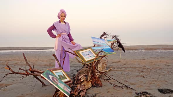 Elegant Woman Leans on Large Driftwood with Put Canvas