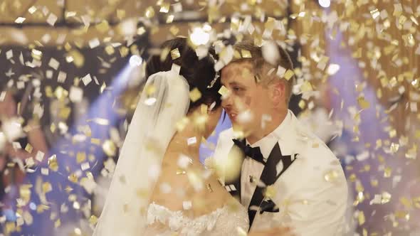 Caucasian Bride Groom Dancing First at the Wedding Party Newlyweds Embracing Falling Confetti