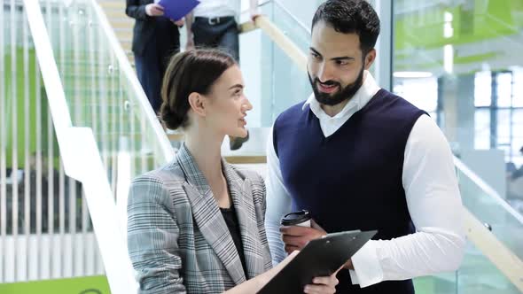 Business People. Man And Woman Talking At Work In Office