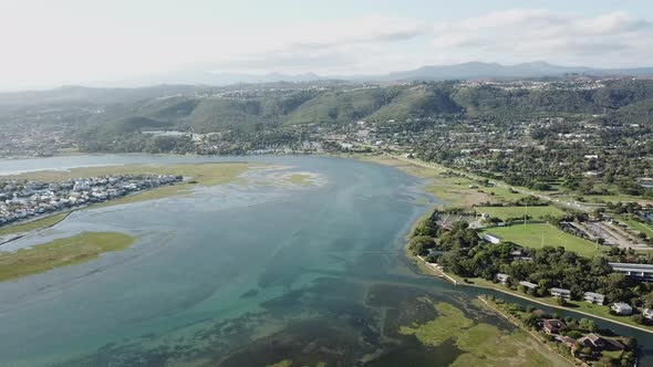 River lagoon and surrounding green hills of Knysna, South Africa aerial