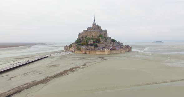 French Castle on a small island in France Le Mont Saint Michel Drone Shot In Normandy Typical Gothic