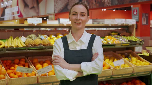 Young Woman Shows Groceries Store with Excitement Closeup