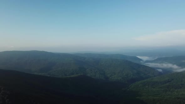 Aerial Landscape View of Caucasus Mountain at Sunny Morning with Fog