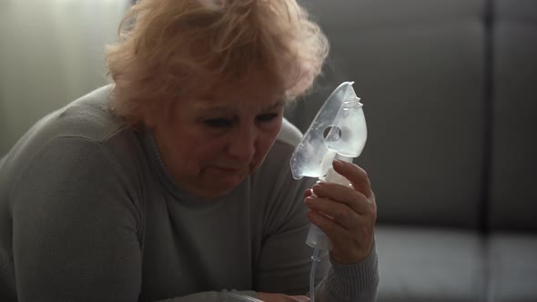 Senior Woman Making Inhalation Elderly Woman and Nebulizer