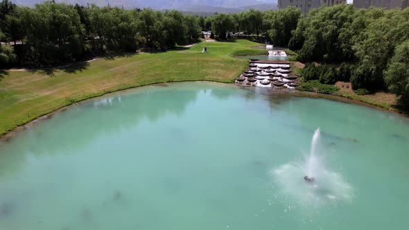 Wedding on a Green Golf Course with a Fountain