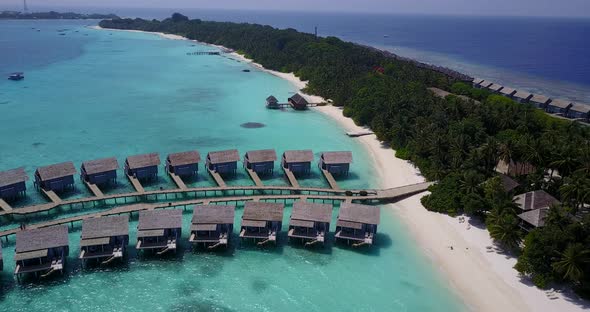 Luxury drone tourism shot of a white sandy paradise beach and blue sea background in best quality 