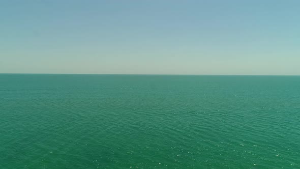 Turquoise Warm Tropical Sea Against the Blue Sky Aerial View