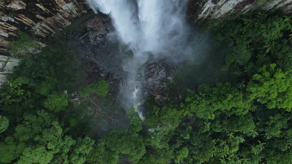 Unique view looking down over a majestic waterfall following a fast flowing natural creek bed. Movin